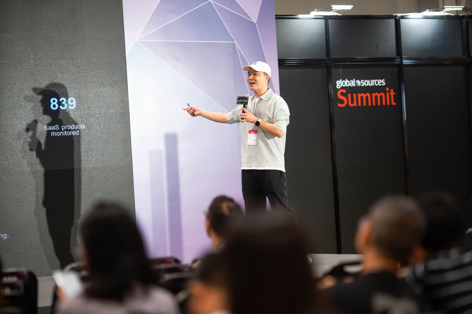 Wide shot of Bill Li delivering the keynote to the crowd